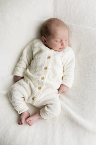 Sleeping Baby wearing Organic Cotton Moss Stitch Baby Romper in Cream