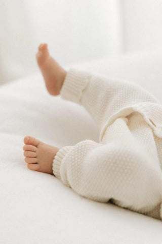 Baby Feet wearing Cream Organic Cotton Baby Romper