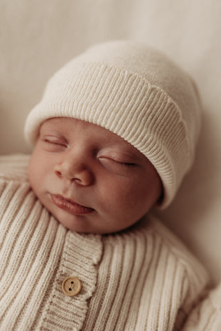 Sleeping Baby wearing knitted hat