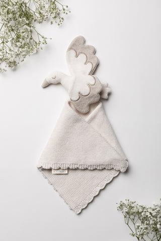 Baby stork comforter knitted with a scalloped edge
