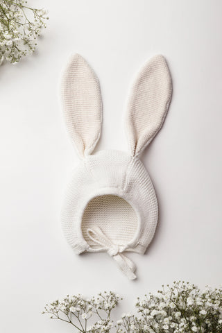 Organic Cotton Bunny Bonnet in Milk/Oat on a White Backdrop with Gypsophilia