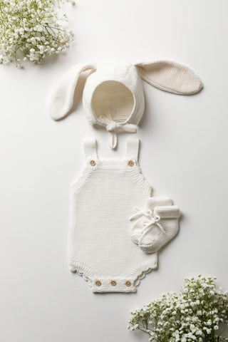 Organic Cotton Bunny Bonnet with matching Milk Romper and Booties on a white backdrop with Gypsophilia