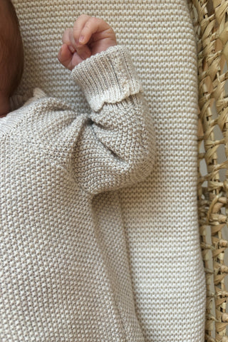 Baby hand close up in moses basket