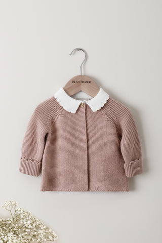 Pink knitted baby cardigan with white frill collar