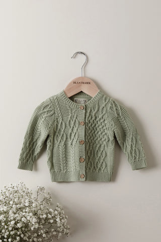 Sage Cable Knit Baby Cardigan on an Isla & Fraser wooden hanger