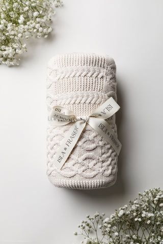 cable patchwork knit blanket tied with an Isla & Fraser ribbon