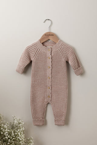 Pink Knit Baby Romper on an Isla & Fraser wooden hanger