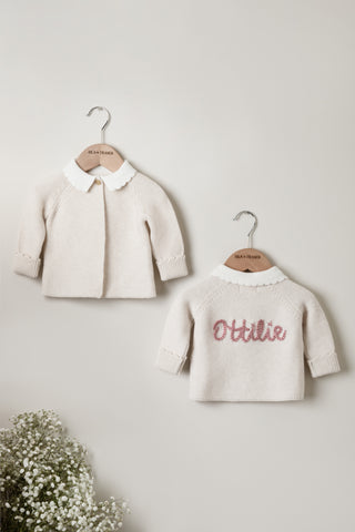 Hand embroidered cardigan with scallop collar and the name Ottilie