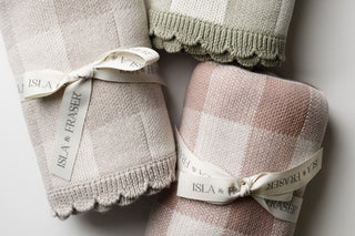 Trio of check baby blankets tied with Isla & Fraser ribbons