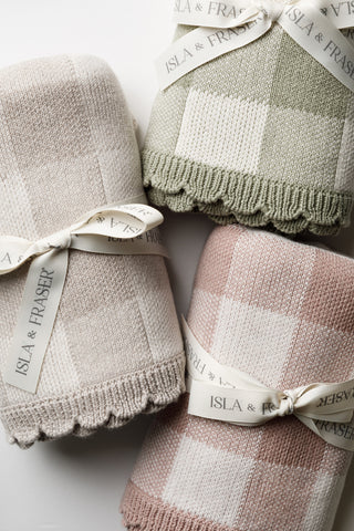 Trio of check baby blankets tied with Isla & Fraser ribbons