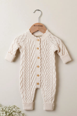 Cable Knit Baby Romper on wooden Isla & Fraser hanger