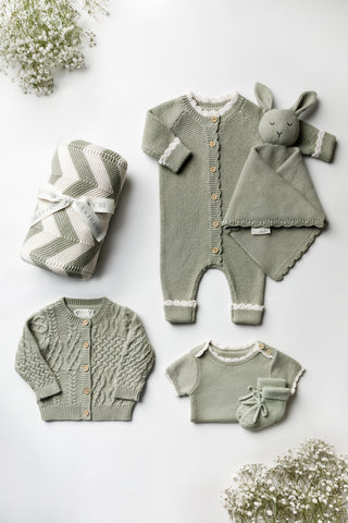 Sage Green Baby Gift Set: romper, bunny comforter, cable knit cardigan, bodysuit, booties, stripe blanket.