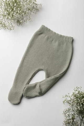 Knitted sage green baby trouser with feet and scalloped waistband