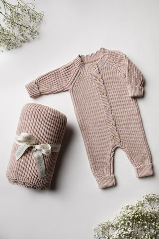 Pink knitted baby blanket and romper