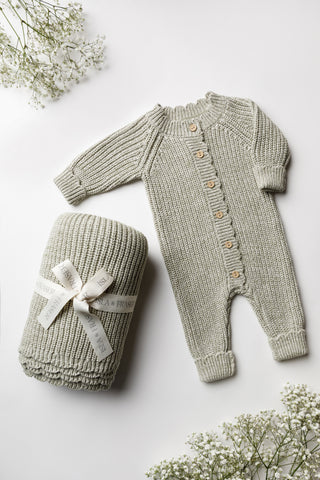 Light green knitted baby blanket and romper