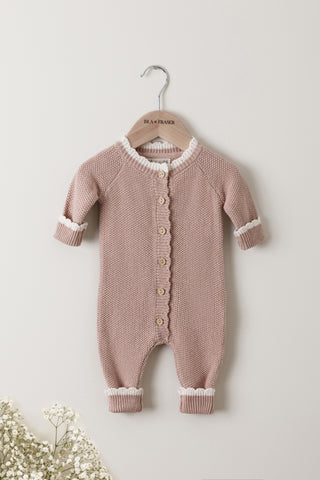 Pink Knitted Baby Romper on an Isla & Fraser wooden hanger