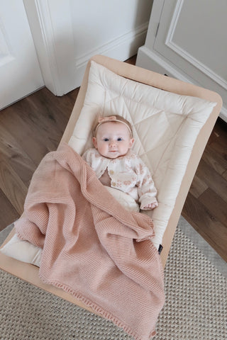 Baby in Rocker with Rose Pink Baby Blanket