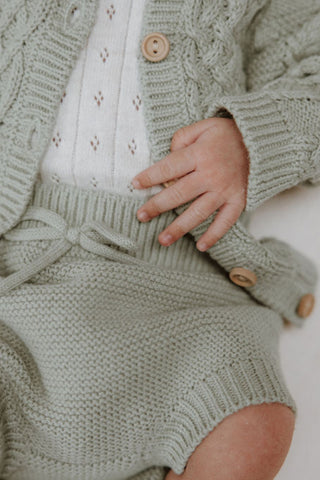 Sage green knitted baby cardigan and bloomers