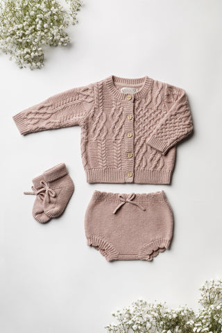 Pink knitted baby outfit