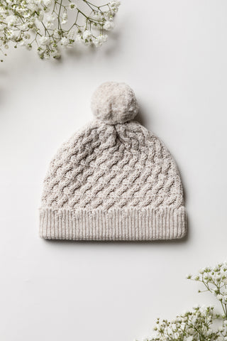 Neutral grey cable knit pom pom hat