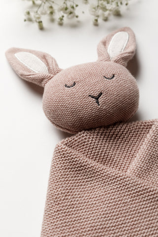 Pink knitted Isla & Fraser bunny comforter with contrast ears and sleepy face embroidery