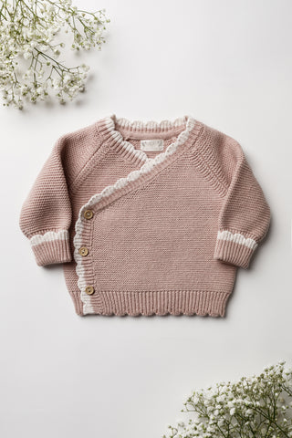 Pink Knitted Wrap Baby Cardigan with a cream scalloped edge