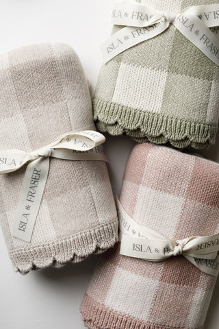Trio of check baby blankets tied with Isla & Fraser ribbons