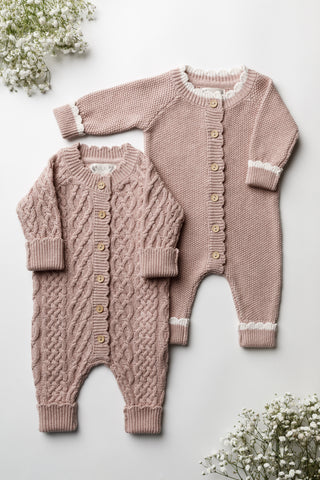 Pair of pink knitted baby rompers