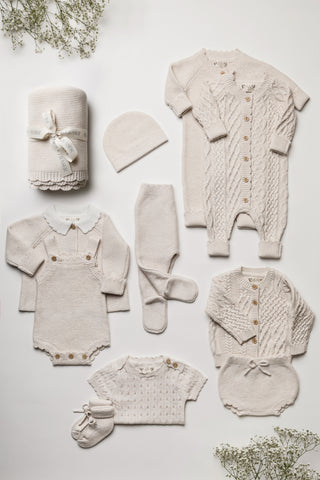 Knitted gender neutral baby blanket and clothing gift set