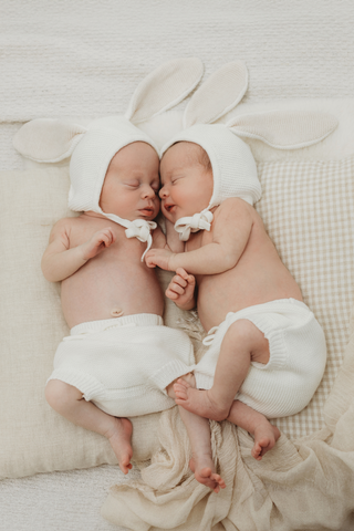 Sleeping Newborn Twins wearing Organic Bunny Bonnets in Milk with matching Milk Bloomers